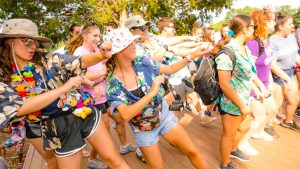 Campers dancing in hawaiian shirts