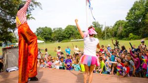 Counselors in costume on stage